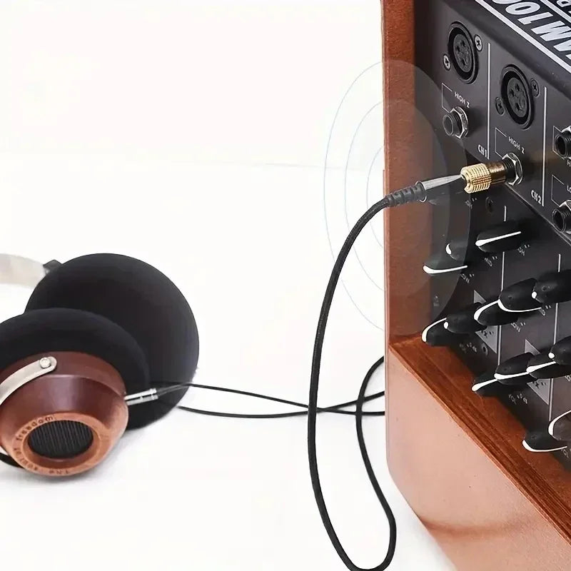 Audio adapter connecting headphones to home audio equipment
